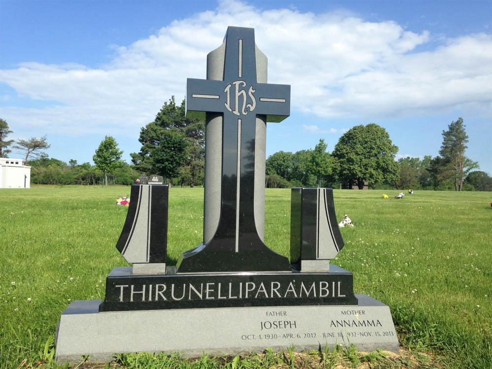 Contemporary family monument made with black granite and with cross and custom vase