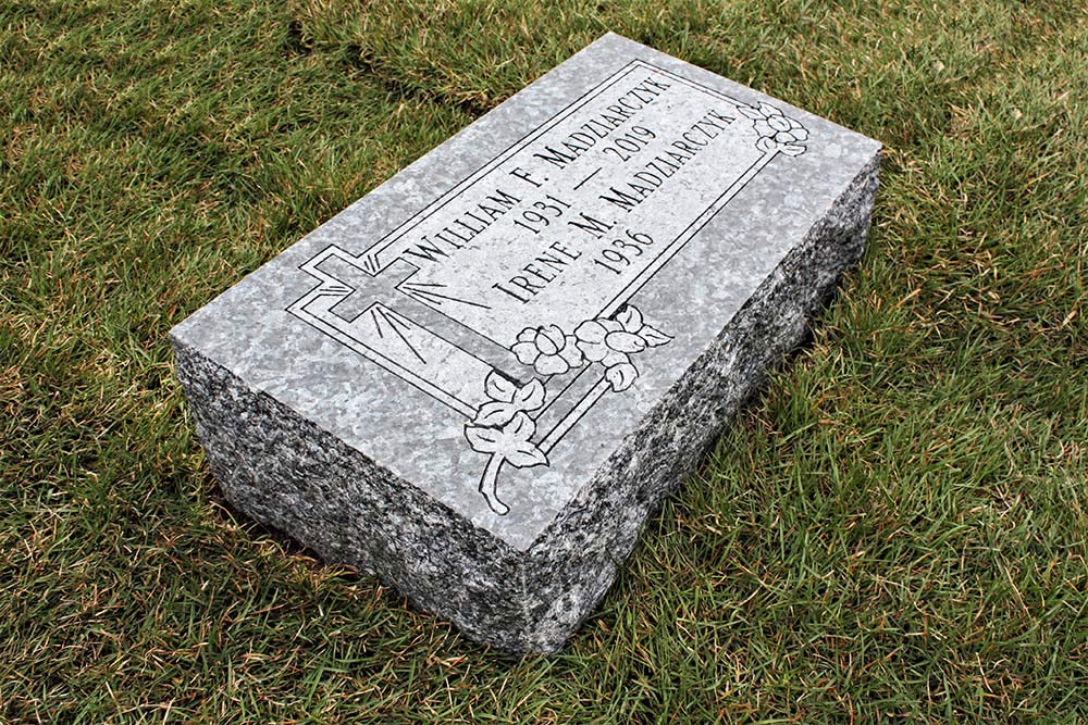 Blue granite bevel marker with 2 names, cross and flowers