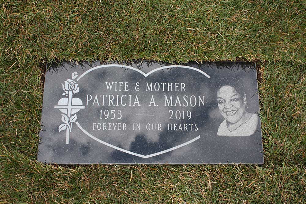 Black granite marker with heart panel and hand engraved portrait