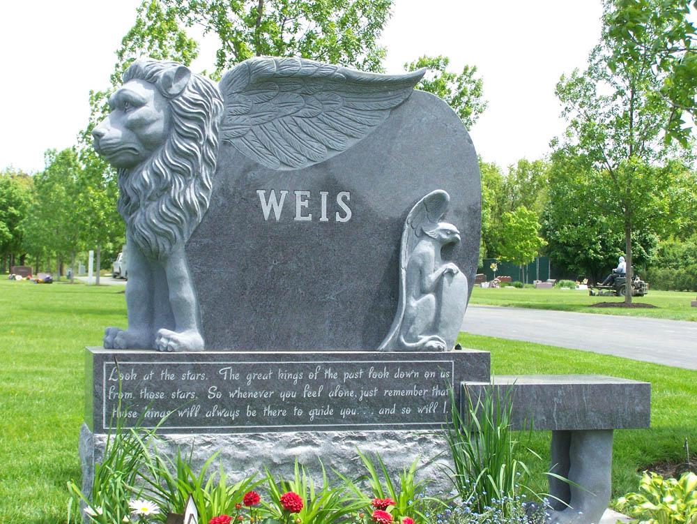 Family monument in blue granite with a griffon sculpture