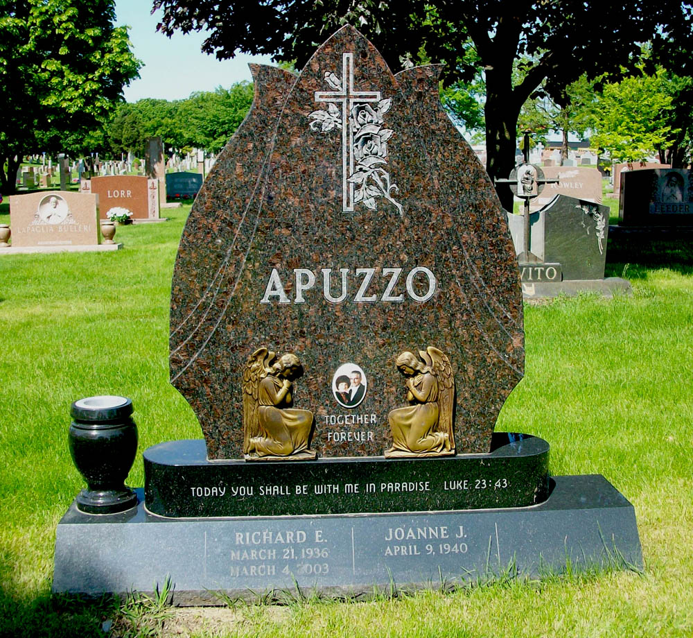 Family monument in brown granite with bronze angels