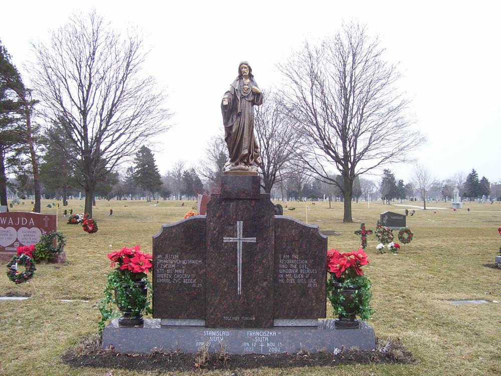 Family monument in brown granite and bronze Jesus