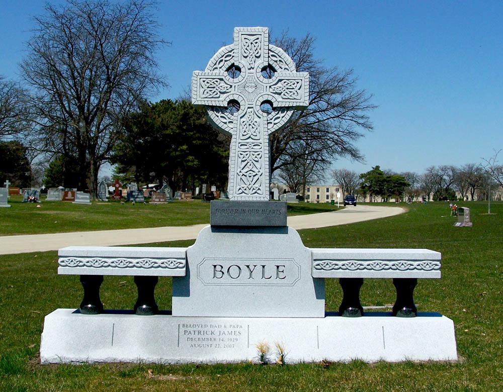 Family monument with a Celtic cross and bench