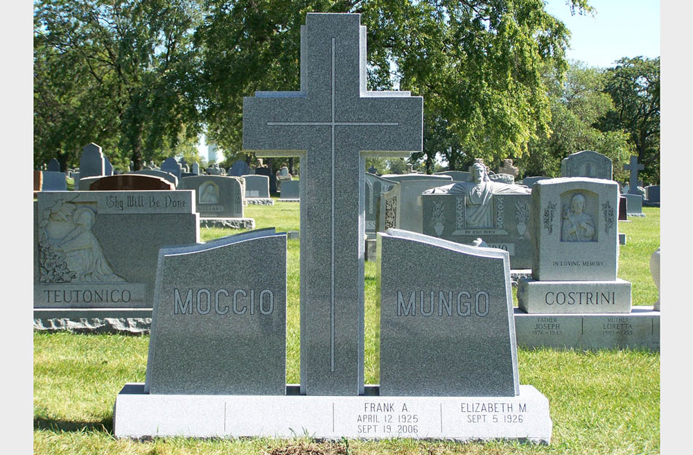 Family monument in grey granite with a cross and two last names