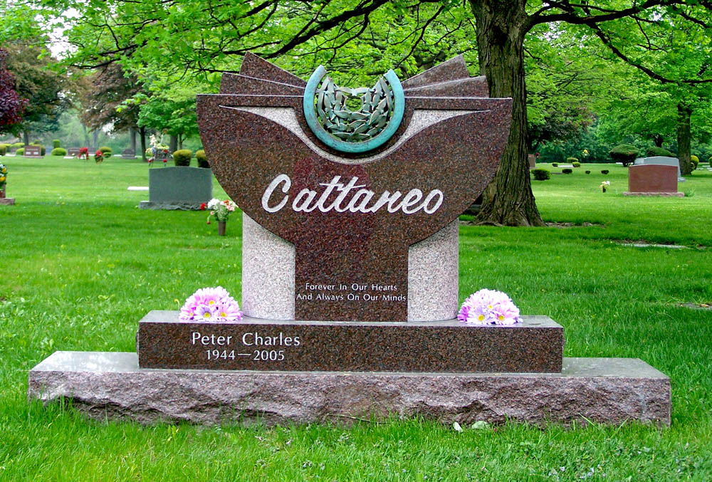 Family monument with stippled texture and bronze appliqué