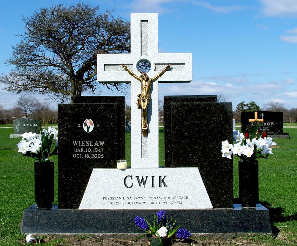 Family monument with bronze Jesus and Polish lettering