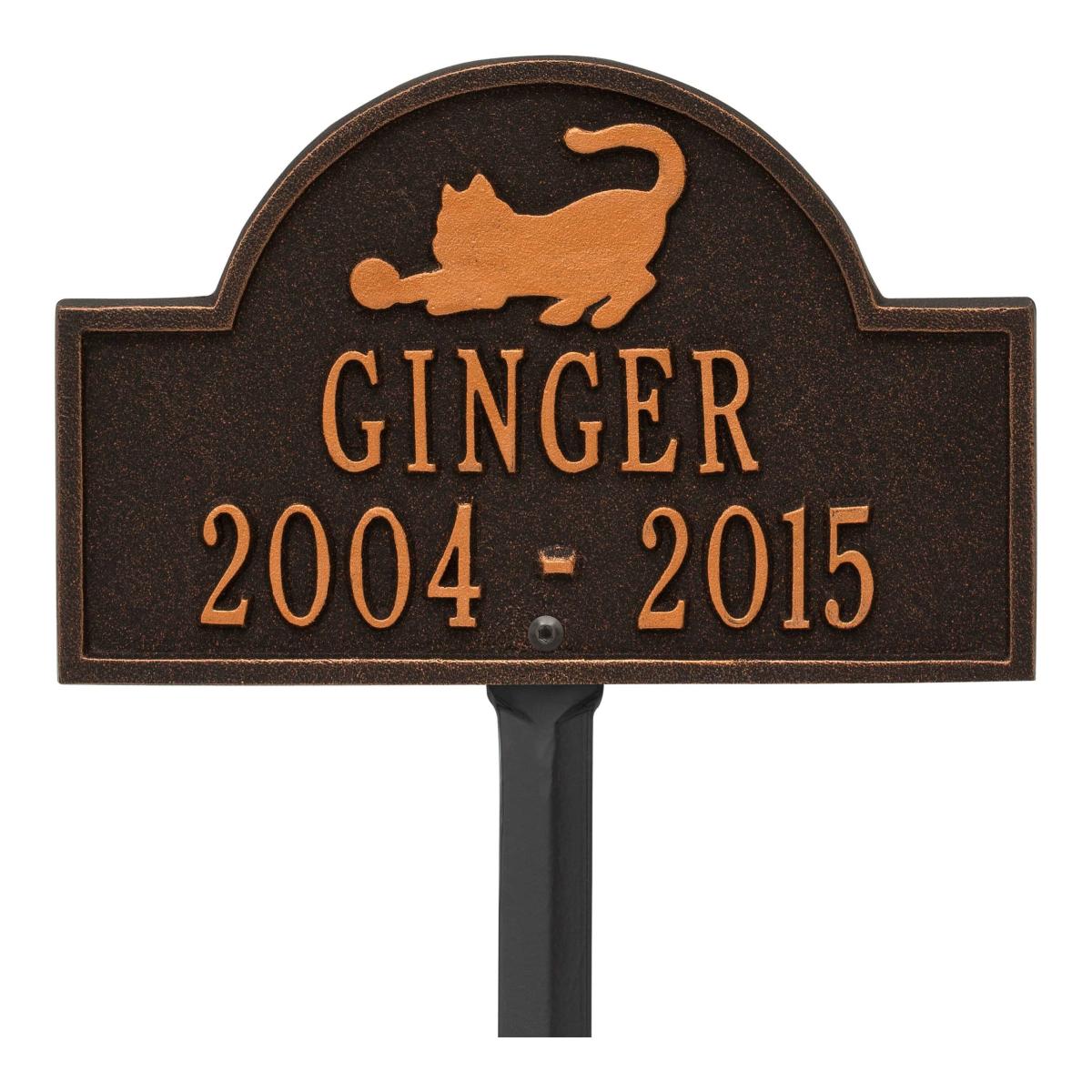 Small rubbed bronze plaque finish with image of cat and dates