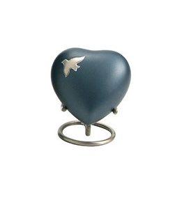 Small dark teal heart shaped urn with silver bird