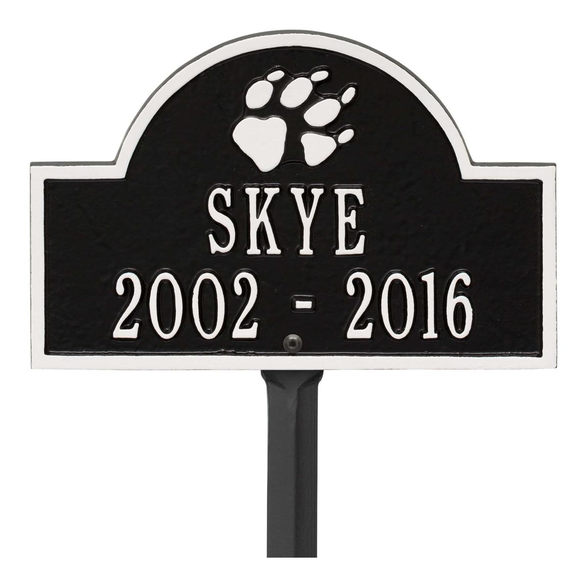 Small black and white plaque finish with image of dog paw and dates