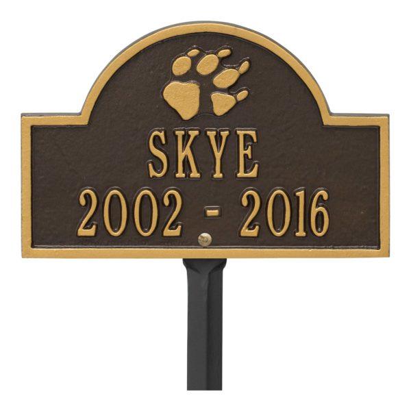Small bronze and gold plaque finish with image of dog paw and dates